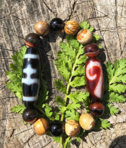 amulet s businoi dzi poisk pradnaznacheniya